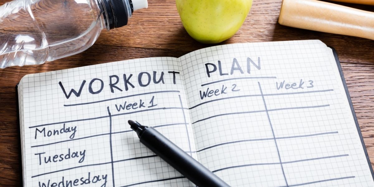 A book that has workout plan written in in then the days of the week