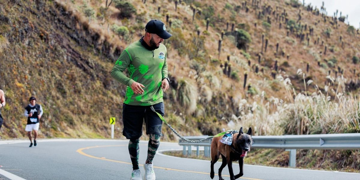 man running with his dog cross country