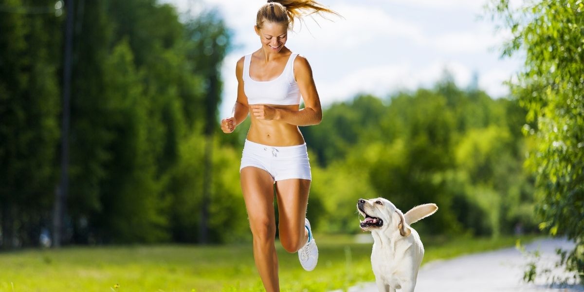 woman running with her dog