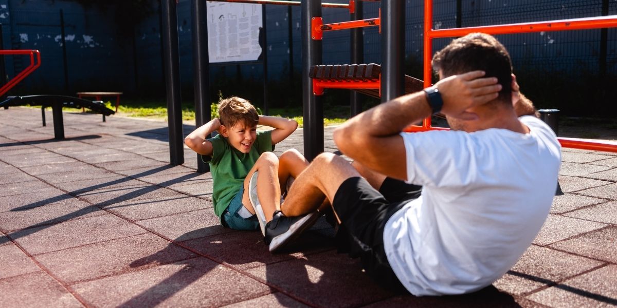 father and son doing sit ups