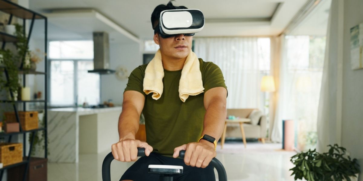man cycling with a vr headset on